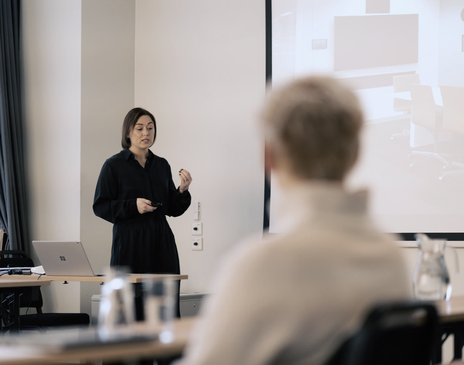 Small workshop group in discussion around a boardroom table